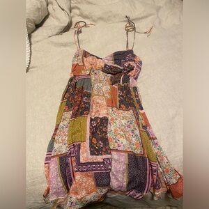 Adorable multi color dress. Ties at shoulders